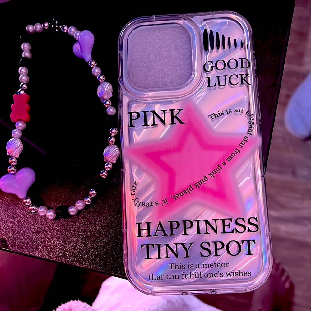 This phone case is for an iPhone 15 Pro Max the case also comes with a charm